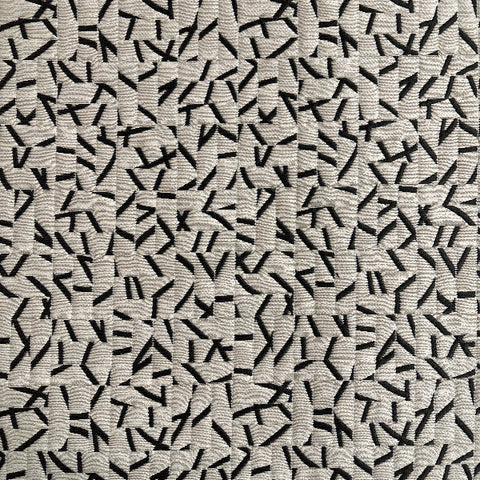 Remnant of Momentum Clip Ivory Black Upholstery Fabric