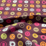 Momentum Symbol Sangria Upholstery Fabric